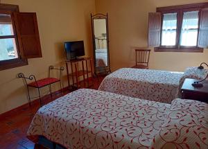 Posteľ alebo postele v izbe v ubytovaní Casa Cofrades