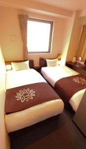 Кровать или кровати в номере Floral Hotel · SakaisuJi-Honmachi Osaka
