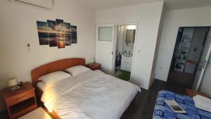 Posteľ alebo postele v izbe v ubytovaní Guesthouse Podaca