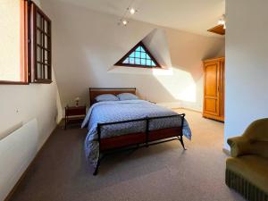 Ένα ή περισσότερα κρεβάτια σε δωμάτιο στο Gîte De Vacances Jardin Monet Giverny Vernon