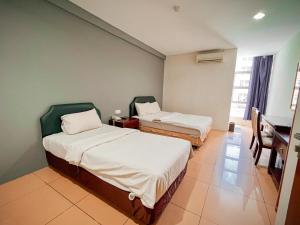 เตียงในห้องที่ N9 Business Hotel Sdn Bhd