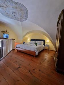 a bedroom with a bed and a ceiling with a clock at My Loft Catania in Catania