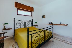 Кровать или кровати в номере Cuore di Ognina - Appartamenti vista mare