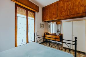 Кровать или кровати в номере Cuore di Ognina - Appartamenti vista mare