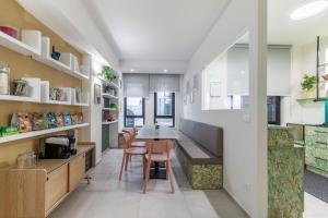 a kitchen with white cabinets and a counter with chairs at Taormina Town - Guesthouse Sicily in Taormina +78 photos