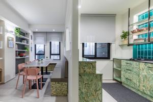 a kitchen with a table and a dining room at Taormina Town - Guesthouse Sicily in Taormina