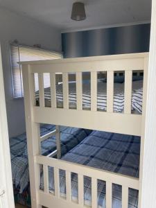 a bunk bed in a room at Chalet 65 in Chapel Saint Leonards