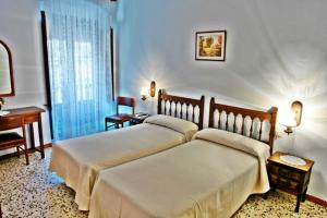 Posteľ alebo postele v izbe v ubytovaní Hostal Populetus