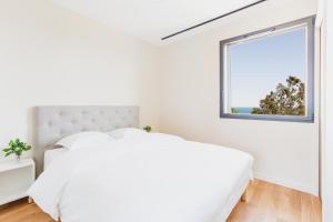 Ένα ή περισσότερα κρεβάτια σε δωμάτιο στο Regina's Banyuls - Exclusive Villa