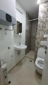 a bathroom with a sink and a toilet at Bistrik Studio in Sarajevo
