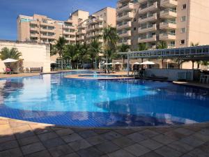 The swimming pool at or close to Flat Clarissinha