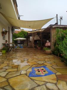 a stone patio with a painting on the floor at B&B Zia Delia in Villaperuccio