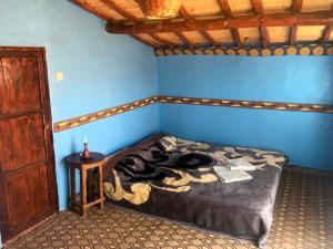 Postel nebo postele na pokoji v ubytování Desert Tours & Camp Chraika