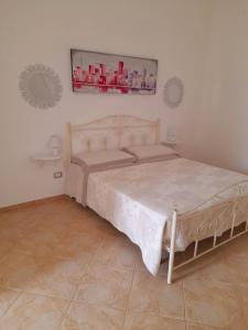 a bedroom with a large bed in a room at il Pascià Affittacamere in Otranto