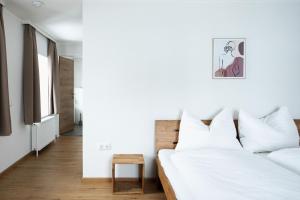 מיטה או מיטות בחדר ב-Grabmayrhof