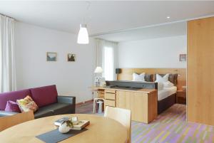 Giường trong phòng chung tại Quality Hosts Arlberg - Hotel ANTON