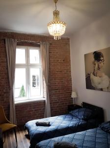 Posteľ alebo postele v izbe v ubytovaní Topolove Rooms & Apartments