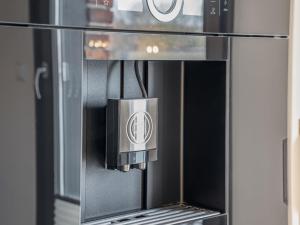 a microwave oven with a sticker on the front of it at Speicher Hafendomizil in Barth +24 photos