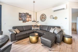 a living room with a couch and a table at Speicher Hafendomizil in Barth