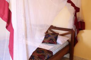 a bunk bed with two pillows on it at Tipitipi house in Kizimkazi