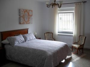 Posteľ alebo postele v izbe v ubytovaní ACAO Vivienda Uso Turístico ARRIBES del Duero