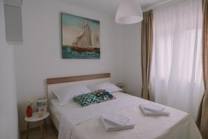 Posteľ alebo postele v izbe v ubytovaní Apartman Garden