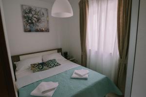 Posteľ alebo postele v izbe v ubytovaní Apartman Garden