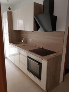 Kuchyňa alebo kuchynka v ubytovaní Apartman Garden