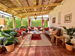 a living room with a couch and a table at VILLA BINISABEL NOU, CONFORT Y EXCLUSIVIDAD in Sant Lluis