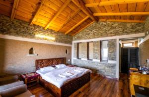 Ένα ή περισσότερα κρεβάτια σε δωμάτιο στο Meraki Huts
