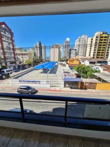 a view of a city from a train window at Apartamento 3 Quartos, Churrasqueira, Vista Mar, Varanda, 5 min da praia in Guarapari