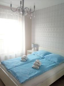 Rezydencja Ustronie - Apartament Slonecznyにあるベッド