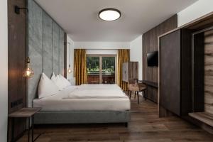 Posteľ alebo postele v izbe v ubytovaní Hotel Das Kohlmais