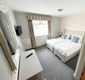 Letto o letti in una camera di The Cliff House Hotel
