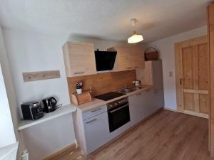 Kuchyň nebo kuchyňský kout v ubytování Ferienhaus Rosl am Grundlsee