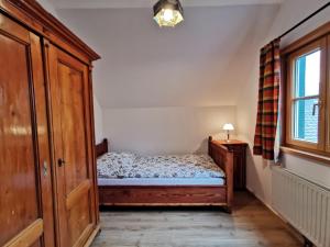 Postel nebo postele na pokoji v ubytování Ferienhaus Rosl am Grundlsee