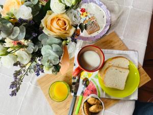 a table with bread and a bowl of milk and flowers at Da Benedetta in Cantagrillo
