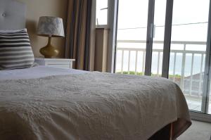 Letto o letti in una camera di The Cliff House Hotel