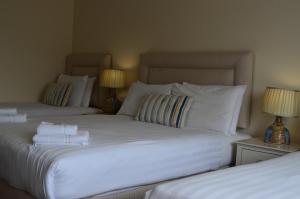 Letto o letti in una camera di The Cliff House Hotel