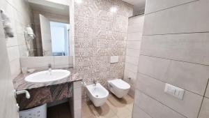 Koupelna v ubytování Aparthotel Codex + 10 fotografií