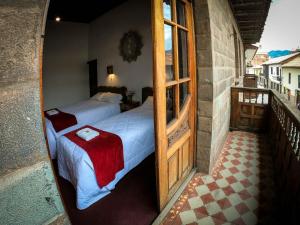 Postel nebo postele na pokoji v ubytování Casona Santa Catalina Cusco