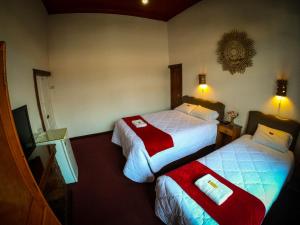Postel nebo postele na pokoji v ubytování Casona Santa Catalina Cusco