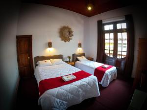 Postel nebo postele na pokoji v ubytování Casona Santa Catalina Cusco
