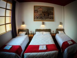 Postel nebo postele na pokoji v ubytování Casona Santa Catalina Cusco