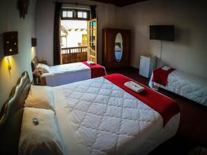 Postel nebo postele na pokoji v ubytování Casona Santa Catalina Cusco