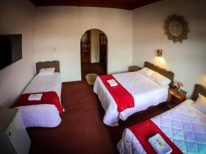 Postel nebo postele na pokoji v ubytování Casona Santa Catalina Cusco