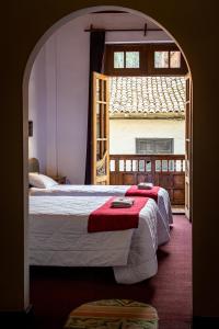 Postel nebo postele na pokoji v ubytování Casona Santa Catalina Cusco