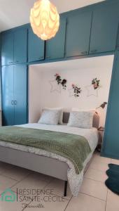 Ένα ή περισσότερα κρεβάτια σε δωμάτιο στο Résidence Sainte-Cécile