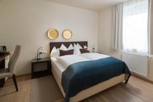 Łóżko lub łóżka w pokoju w obiekcie Hotel Post Wrann
