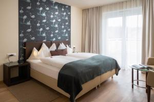 Łóżko lub łóżka w pokoju w obiekcie Hotel Post Wrann